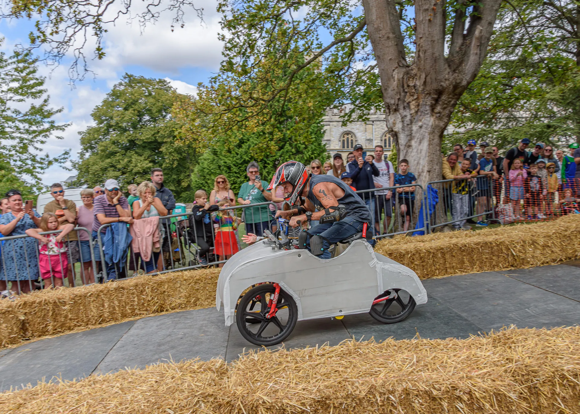 Hand-built soapbox karts race down the 100-metre track at Dunstable's Soapbox Derby in Priory Gardens.