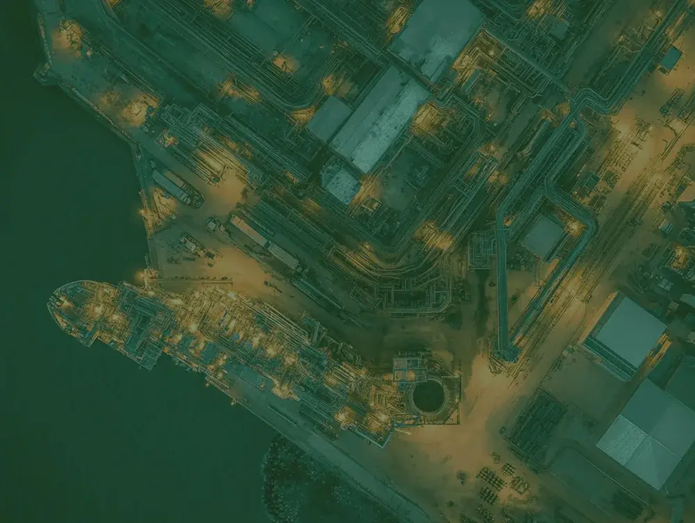 Top down view of a complex industrial piping and road system