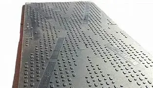 A gray rectangular TuffTrak board covered in grids of small, square, raised bumps. 'XEROX' text is visible with clear plastic pegs.